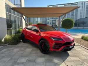 Red Lamborghini Urus 2024 luxury SUV parked in Dubai marina