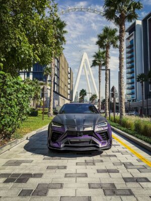 Purple and black Lamborghini Urus Mansory edition front angle view