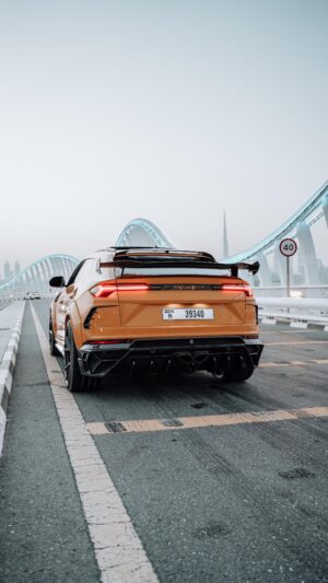 Orange and black Lamborghini Urus 2024 on Sheikh Zayed Bridge Dubai