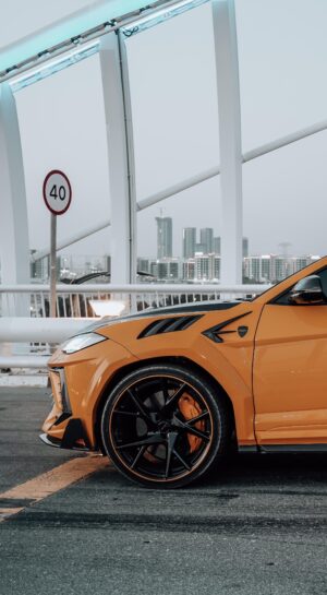 Orange and black Lamborghini Urus 2024 on Sheikh Zayed Bridge Dubai