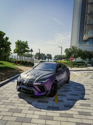 Purple and black Lamborghini Urus Mansory edition front angle view
