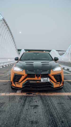 Orange and black Lamborghini Urus 2024 on Sheikh Zayed Bridge Dubai
