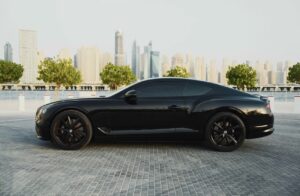 Black Bentley Flying Spur luxury sedan front view in Dubai