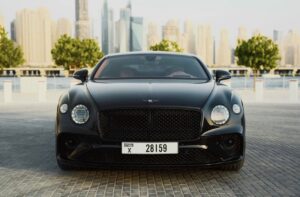 Black Bentley Flying Spur luxury sedan front view in Dubai