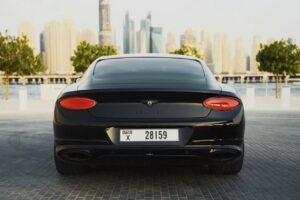 Black Bentley Flying Spur luxury sedan front view in Dubai