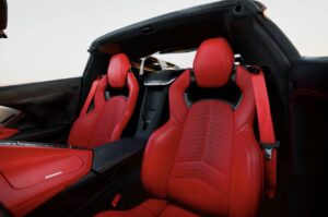 Chevrolet Corvette C8 with black racing stripe in Dubai desert