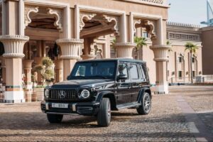 Black 2025 Mercedes-AMG G63 luxury SUV parked in front of luxury hotel in Dubai