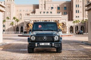 Black 2025 Mercedes-AMG G63 luxury SUV parked in front of luxury hotel in Dubai