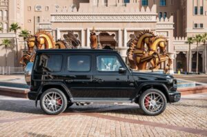 Black 2025 Mercedes-AMG G63 luxury SUV parked in front of luxury hotel in Dubai