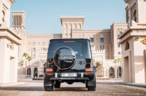Black 2025 Mercedes-AMG G63 luxury SUV parked in front of luxury hotel in Dubai