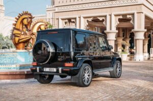 Black 2025 Mercedes-AMG G63 luxury SUV parked in front of luxury hotel in Dubai