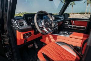 Black 2025 Mercedes-AMG G63 luxury SUV parked in front of luxury hotel in Dubai