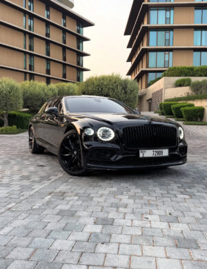 Black Bentley Flying Spur luxury sedan front view in Dubai