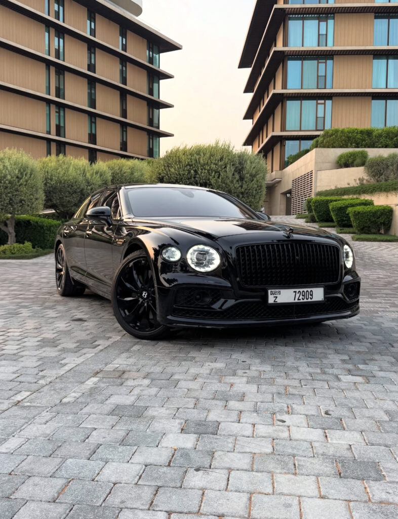 Black Bentley Flying Spur luxury sedan front view in Dubai