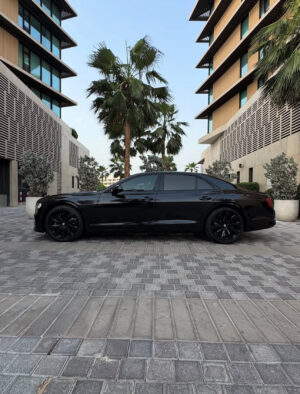 Black Bentley Flying Spur luxury sedan front view in Dubai