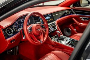 Black Bentley Flying Spur luxury sedan front view in Dubai