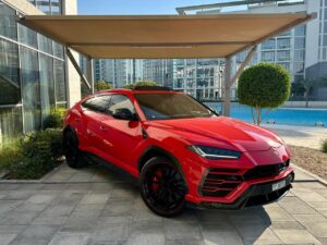 Red Lamborghini Urus 2024 luxury SUV parked in Dubai marina